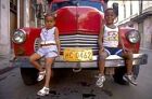 Cuban kids on an old car in Havana.