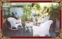This is a nice terrac ewith plants and chairs.
