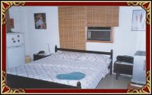  This is the airconditioned bedroom with a double bed, TV and minibar.  The bathroom is next to the bedroom.  