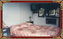 The bedroom with TV and air conditioner