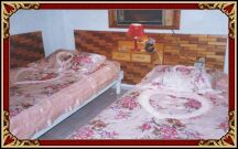  Air conditioned bedroom with two beds.  