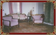  This is the wide living room with nice old style furnitures.  